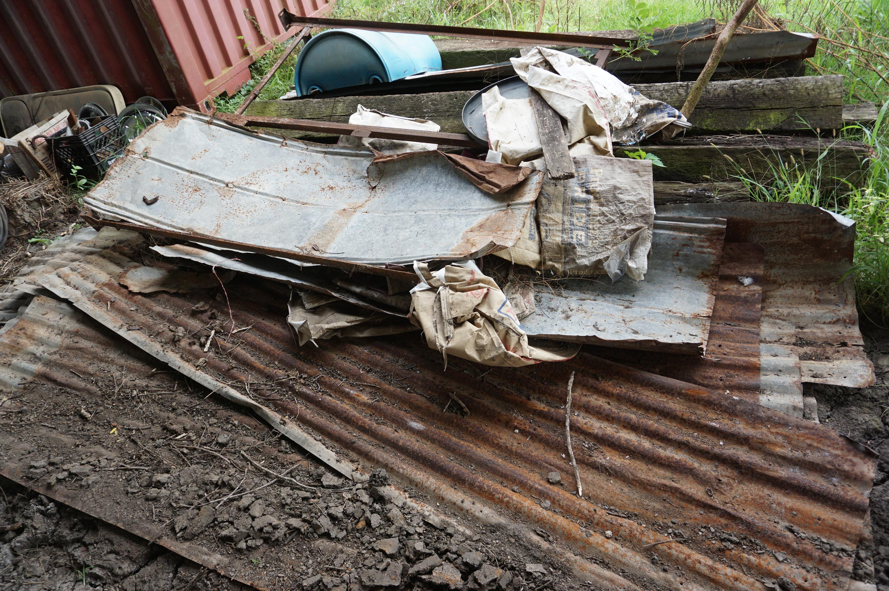 Pile of Railroad Ties and Rusty Tin