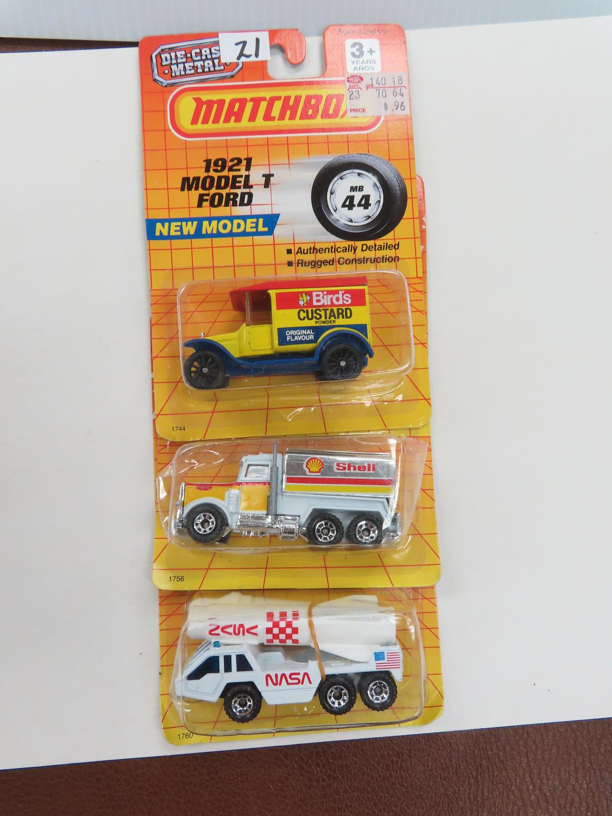 Three (3) 1990-1992 Matchbox Unopened Trucks. 1921 Model T, Shell Peterbilt Tanker, NASA Rocket