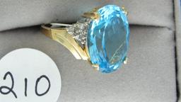 10K y/g 18X13mm blue topaz & 6 diamond ring