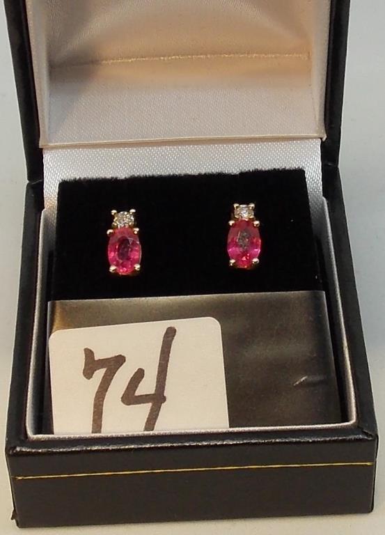 LADIES 10K Y/G OVAL RUBY & .04CT T.W. DIAMOND  EARRINGS