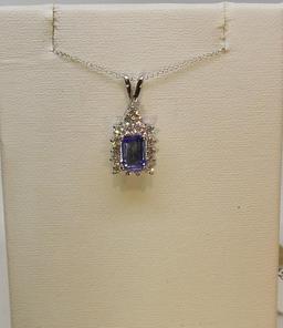 LADIES 14K W/G  .89CT EMERALD CUT TANZ CENTER STONE.44CT T.W. DIAMOND AROUND PENDANT 2.7GR