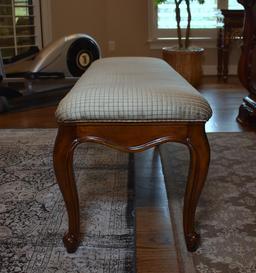 Elegant Carved Wooden Bench with Neutral Upholstered Seat