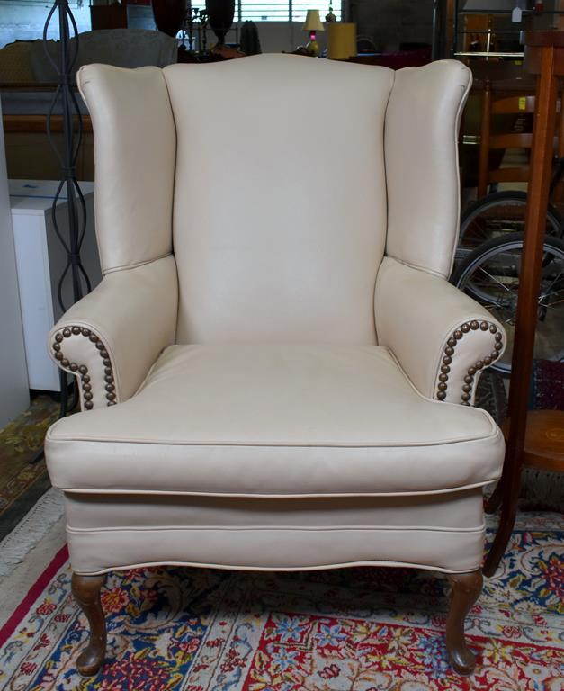 Handsome Cream or Light Tan Leather Wing Chair