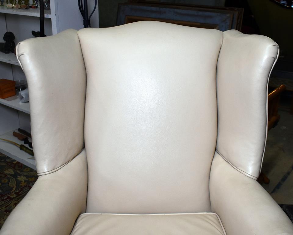 Handsome Cream or Light Tan Leather Wing Chair