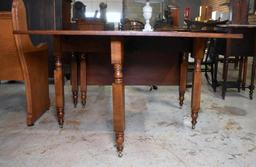 Antique Drop Leaf Cherry Dining Table with New York Legs, Brass Caster Feet