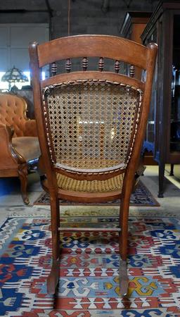 Comfortable Antique Oak Rocker with Caned Back and Seat