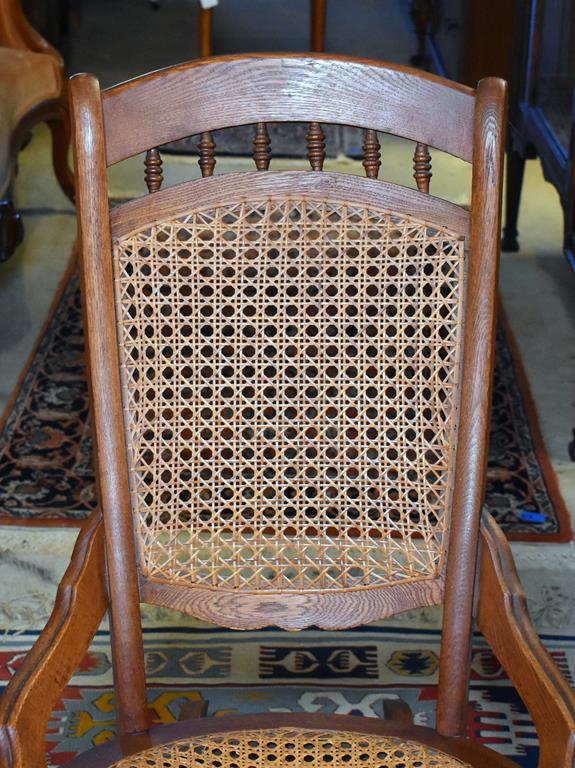 Comfortable Antique Oak Rocker with Caned Back and Seat