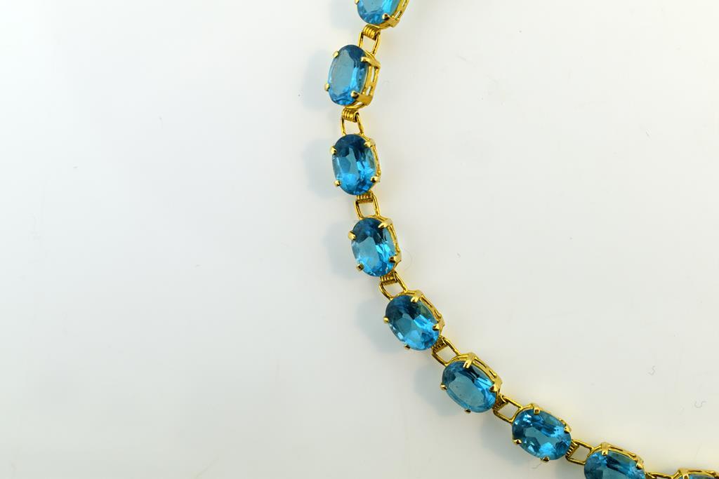 14K Gold and 20 Carat Blue Topaz 7.5” Link Bracelet
