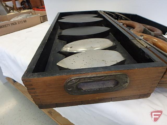 Enterprise set of sad irons in wooden box with dovetailed corners