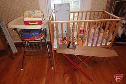 Childrens items, toys, highchair, small crib, ironing board and electric iron, all
