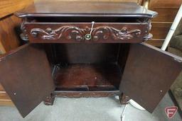 Cabinet with drawer and storage; top has damage in one corner, 30"h x 29"w x 16"d
