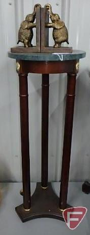 Marble top round table with spindle legs, 32inH, and metal/wood elephant bookends