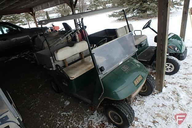 EZ-GO gas golf car with aluminum utility bed, headlight, canopy, windshield