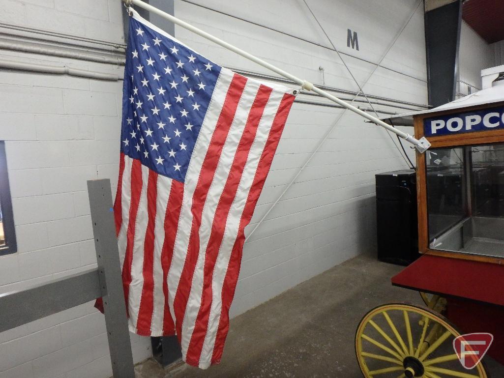 Vintage-style popcorn concession wagon, awning, lights, flagpole with American Flag,