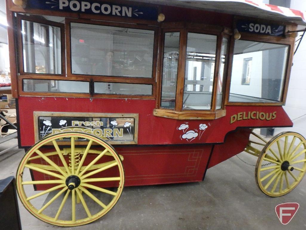 Vintage-style popcorn concession wagon, awning, lights, flagpole with American Flag,