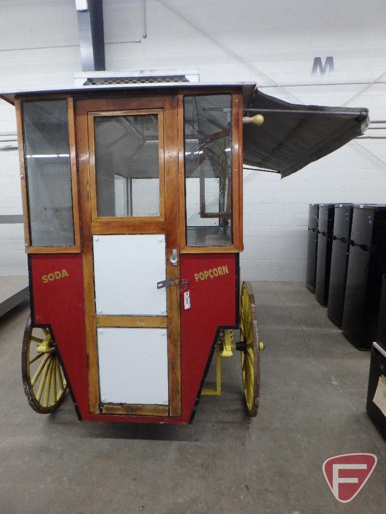 Vintage-style popcorn concession wagon, awning, lights, flagpole with American Flag,