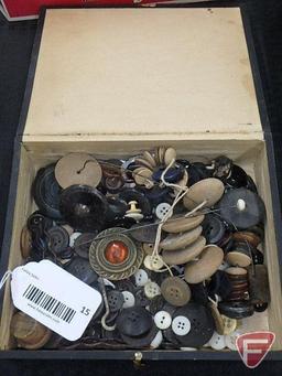 Vintage sewing notions: wood, glass, and metal buttons; hat pins, plastic hair pins, and small wood