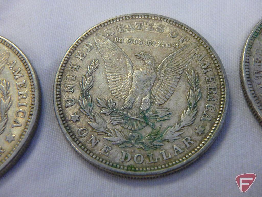 (8) 1921 PD or S Morgan silver dollars, all have varying amounts of PVC