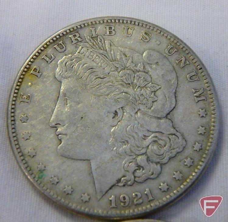 (8) 1921 PD or S Morgan silver dollars, all have varying amounts of PVC