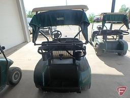 EZ-GO TXT electric golf car, green, has windshield, canopy, rain curtain, charger, SN: 1534398