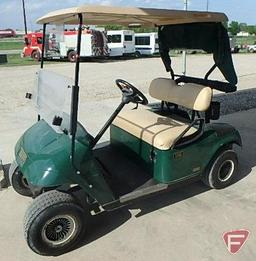 EZ-GO TXT electric golf car, green, has windshield, canopy, rain curtain, SN: 2211596