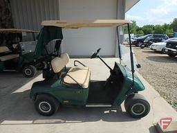 EZ-GO TXT electric golf car, green, has windshield, canopy, rain curtain, SN: 2211596