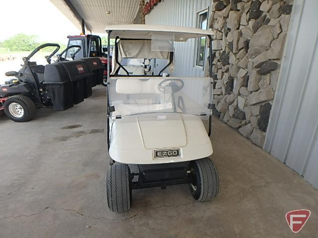 EZ-GO TXT electric golf car, white, has windshield, canopy, rain curtain, charger, SN: 2624655