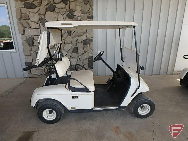 EZ-GO TXT electric golf car, white, has windshield, canopy, rain curtain, charger, SN: 2624655