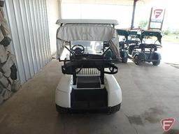 EZ-GO TXT electric golf car, white, has windshield, canopy, rain curtain, charger, SN: 2624655