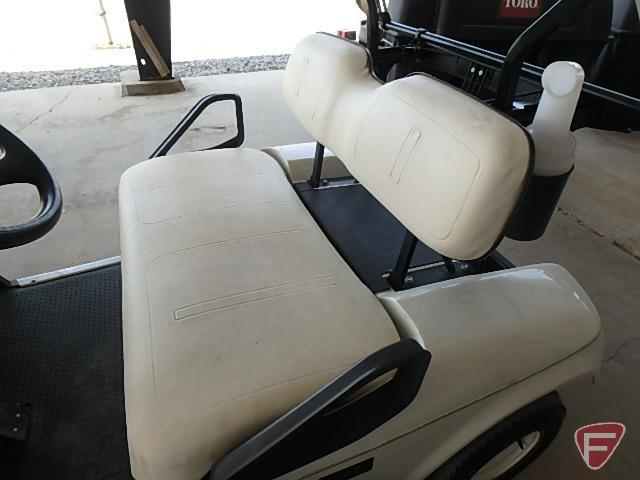 EZ-GO TXT electric golf car, white, has windshield, canopy, rain curtain, charger, SN: 2624655