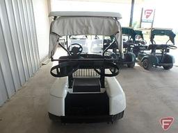 EZ-GO TXT electric golf car, white, has windshield, canopy, rain curtain, charger, SN: 2623897
