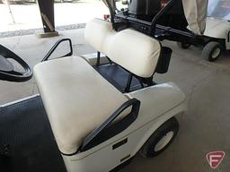 EZ-GO TXT electric golf car, white, has windshield, canopy, rain curtain, charger, SN: 2623897