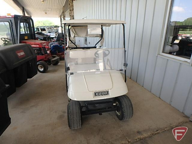 EZ-GO TXT electric golf car, white, has windshield, canopy, rain curtain, charger, SN: 2624656