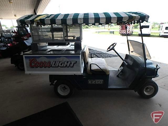 2010 EZ-GO MPT1200 gas utility vehicle with 6-door fiberglass beverage cart body with overhead