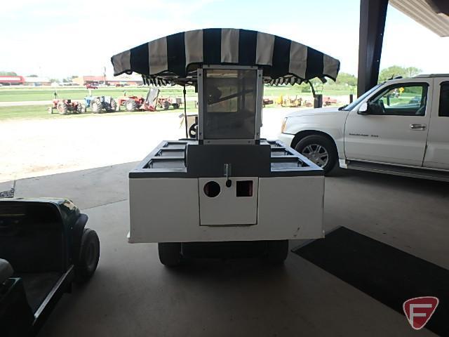 2010 EZ-GO MPT1200 gas utility vehicle with 6-door fiberglass beverage cart body with overhead