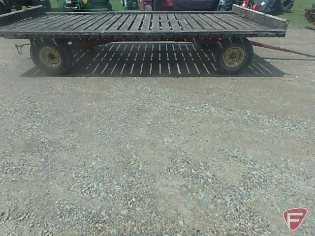 Case running gear with implement tires, with wood hay rack, 8.5 ft. x 16.5 ft.