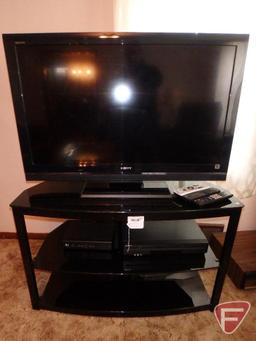 Sony Bravia 40in flat screen TV/television, Sony DVD/VHS player, remotes, and 2 shelf media stand