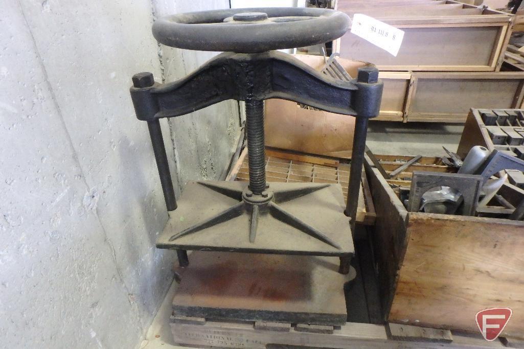 Old hand press with print type spacers