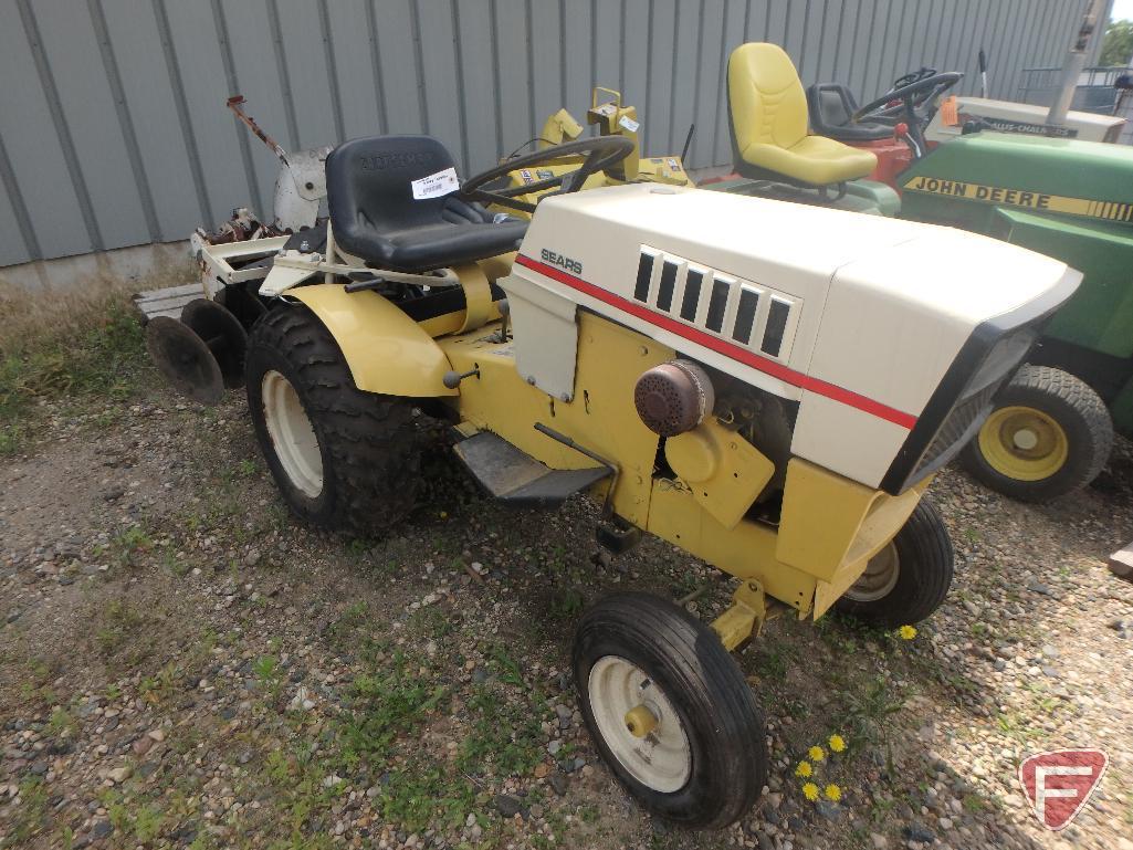 Sears Suburban riding garden tractor with 48in cultivator attachment, 35in snowblower, plow,