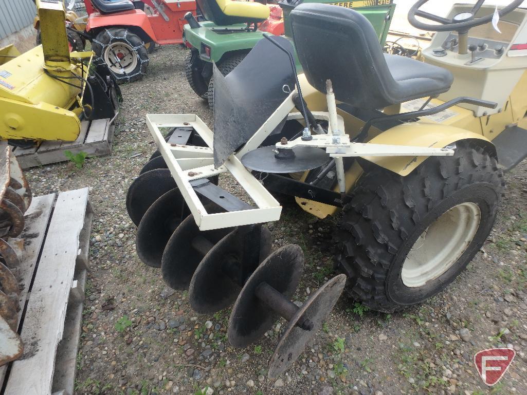 Sears Suburban riding garden tractor with 48in cultivator attachment, 35in snowblower, plow,