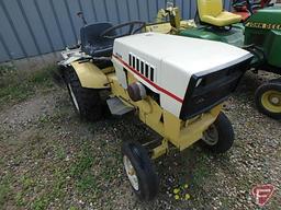 Sears Suburban riding garden tractor with 48in cultivator attachment, 35in snowblower, plow,