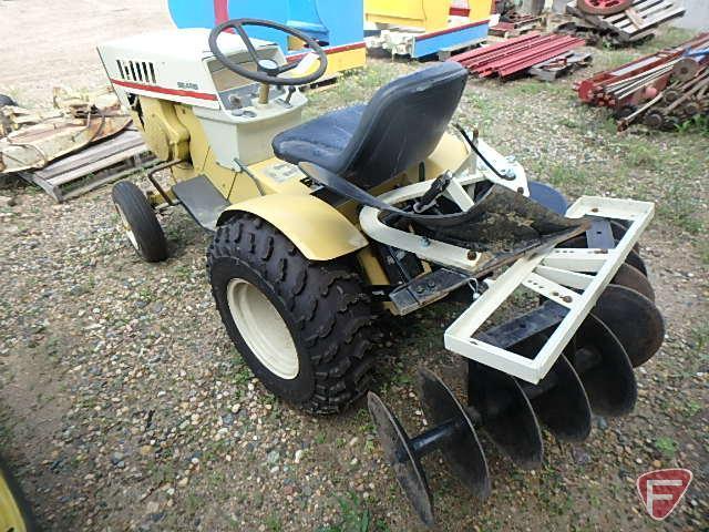 Sears Suburban riding garden tractor with 48in cultivator attachment, 35in snowblower, plow,