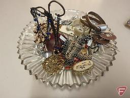Earrings, bracelets, necklaces, (2) purse hanging sets. All jewelry and trays on bottom shelf