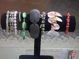 Necklaces, earrings, bracelets on displays. Jewelry and displays