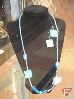 Necklaces, earrings, bracelets on displays. Jewelry and displays