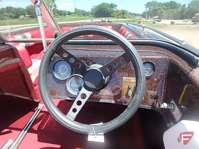 1982 Baja 160BR speedboat with 115HP Johnson outboard, ski pole, and 1982 EZ Loader trailer