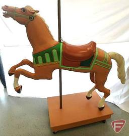 Wood carousel horse mounted on pole on wood platform with wheels, 66inHx25inWx68inD