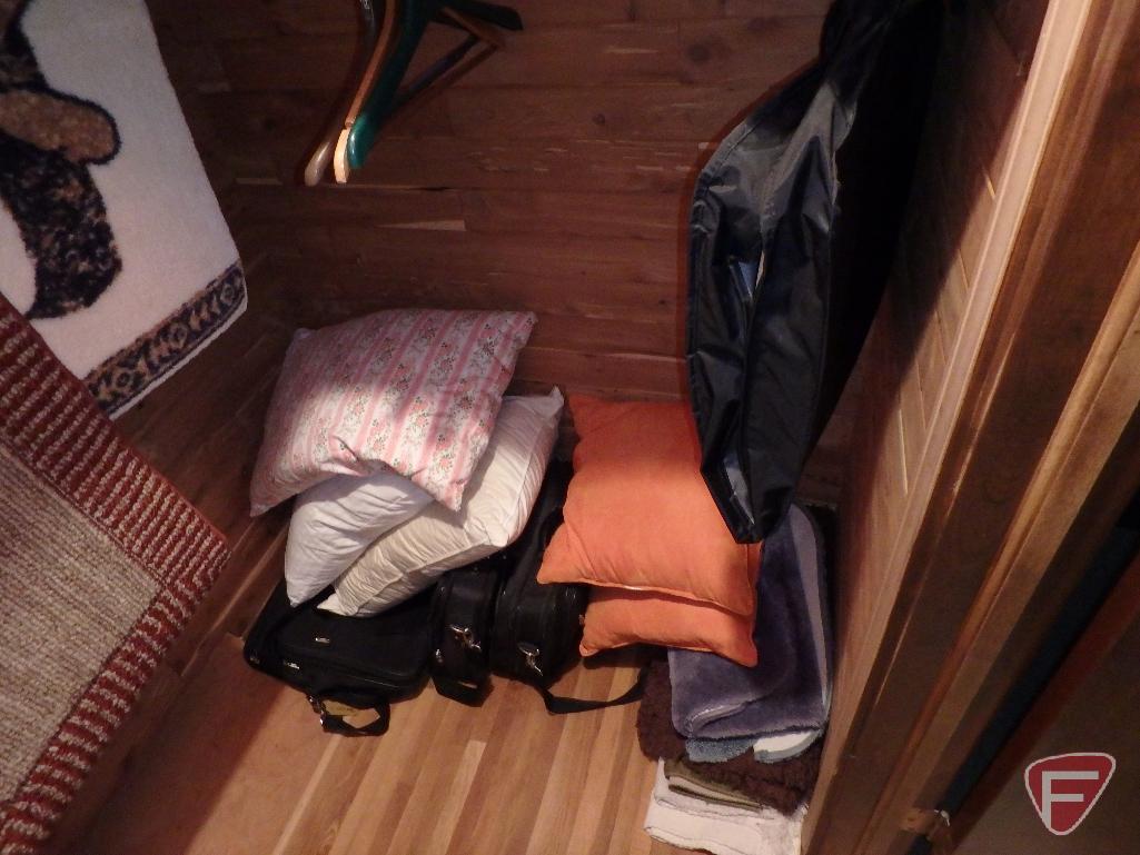 Assortment of pillows, down comforter, rugs, briefcase/bags, heating pads. Everything in closet