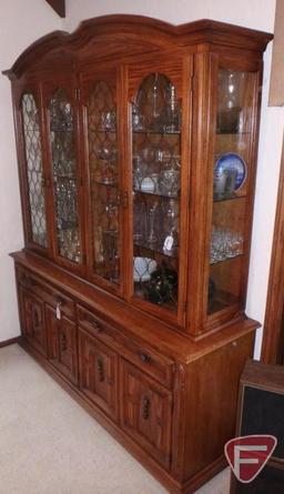 Wood and glass china cabinet, lighted, 6 adjustable glass shelves, 2 drawers, and 4 doors,
