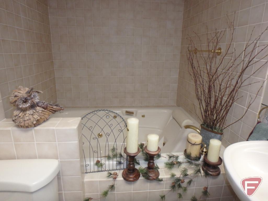 Bathroom rugs, wicker stool, metal tissue cover, soap dispenser, and cup holder, candles,